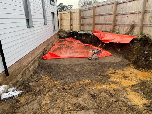 Laying of no-dig layer and membrane prior to placing of clean sub and topsoil